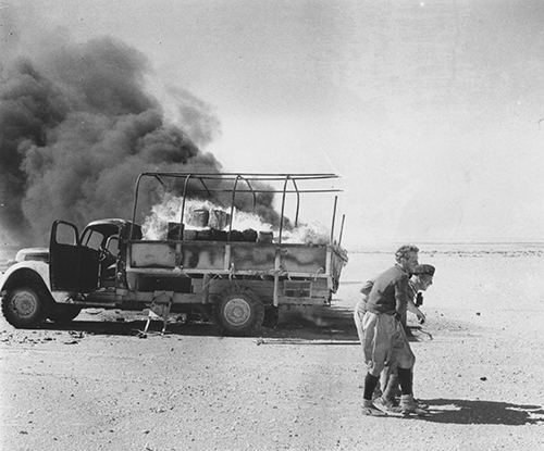 A British casualty being helped in Gazala 1942