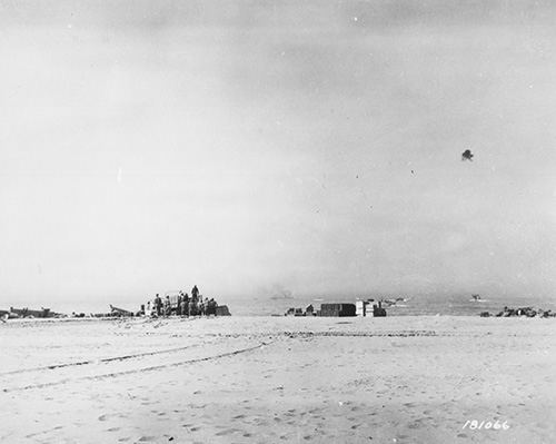 Men unloading on beach