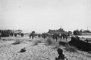 Tanks and soldiers come ashore
