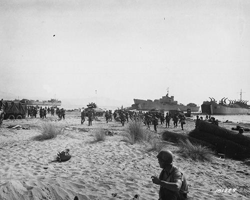 Tanks and soldiers come ashore