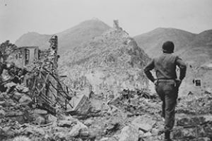 American soldier looks up at Monte Cassino