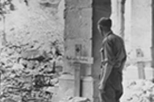 British soldier with German graves in Monte Cassino