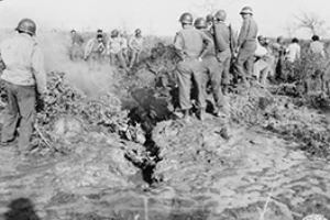 5th Army troops inspect aircraft