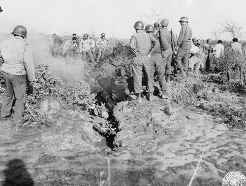 5th Army troops inspect aircraft