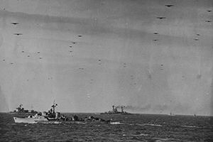 Cruisers wait off the Normandy Coast