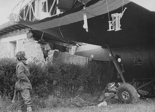 NCO examines a crashed Horsa Glider