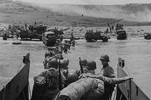 Browse American assault troops come ashore at Utah.