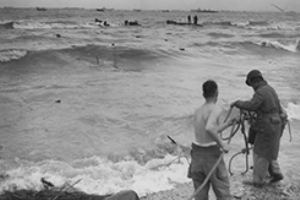 Browse Two American soldiers string a lifeline