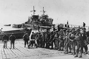 US troops wait to board their transport