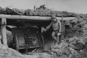 Browse An American soldier examines a 75mm German gun