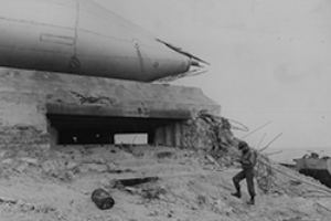 US soldier examines a German pillbox