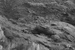 German bomb hanging off edge of cliff
