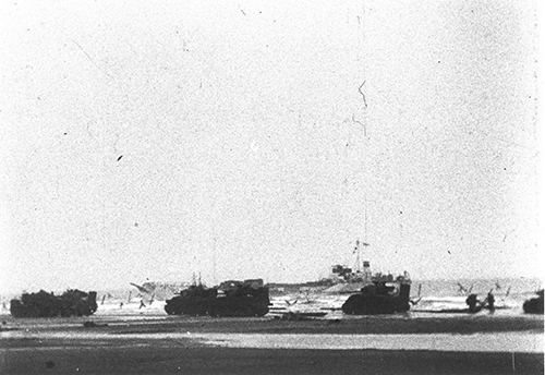 Vehicles coming ashore on Gold Beach