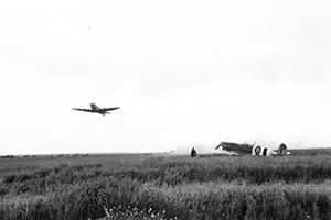 Browse Aircraft take off from a post invasion air field