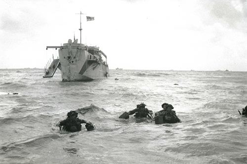 Troops wading ashore on Queen beach