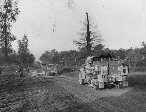 Tanks and infantry cross the River Orne