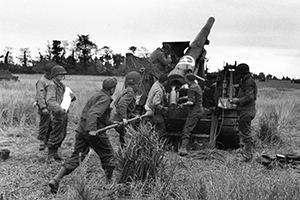 Gunners of an American 155 mm gun