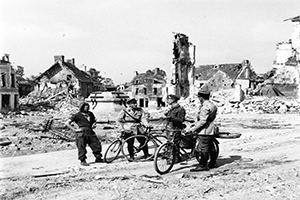 Browse Two French policemen chat with a British Officer