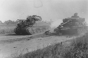 Browse A Sherman tank passes a wrecked German Mk IV
