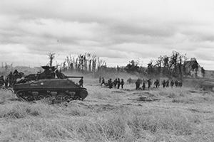 Sherman tanks and infantry