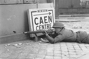 Browse A soldier in the ruins of Caen, 9 July 1944.