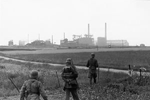 A German patrol moves towards the Colombelles factory area