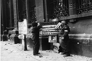 Browse British troops removing German signage