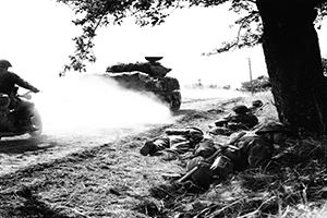 Sherman tanks followed by despatch riders