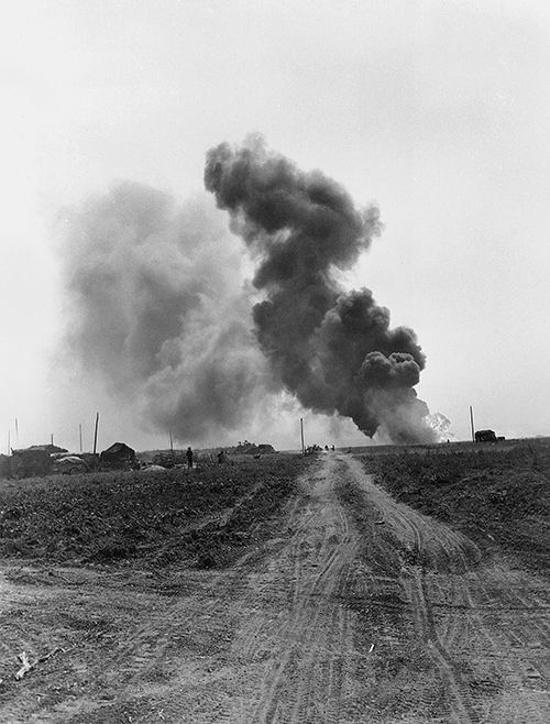 An ammunition truck burns fiercely near Cintheaux