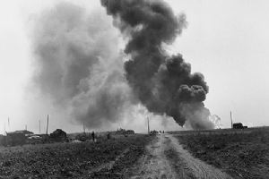 An ammunition truck burns fiercely near Cintheaux