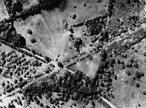German vehicles at a crossroads near Orbec