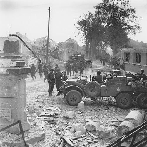 British Cromwell tanks meet up with American infantry