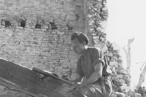 Browse Canadian NCO improvises a desk to write a letter