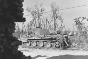 Mont Royal fusiliers inspect a knocked out Hitlerjugend Panther