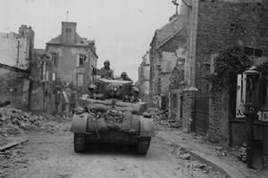 Browse American tank lumbers through the streets of St-Lo