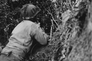 Browse US infantryman wields a light machine gun