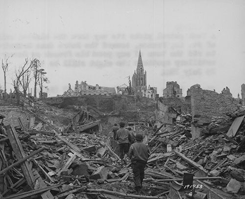 A US patrol picks its way through St Lo