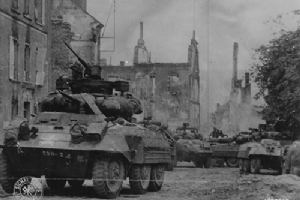 Browse Troops move through St-Lo