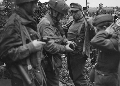 Captured German troops being searched (BU 1127)