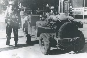 German soldier seated in a British jeep