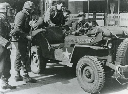 German soldier seated in a British jeep