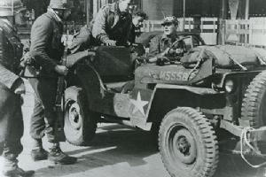 German soldier seated in a British jeep