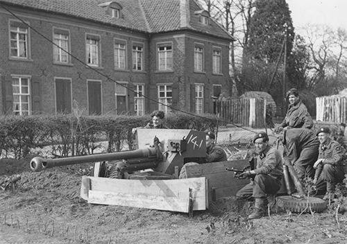 A 6-pdr anti-tank gun guards a road junction