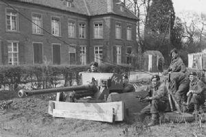 A 6-pdr anti-tank gun guards a road junction