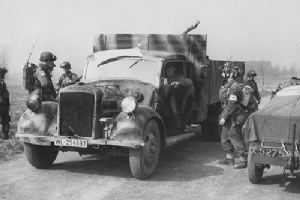 Airborne troops with a requistioned German truck