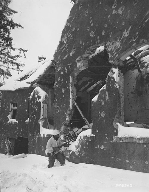 Pfc D C Cox of Amarillo house clearing in the Ardennes
