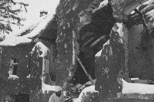Pfc D C Cox of Amarillo house clearing in the Ardennes