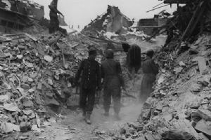 German prisoners help men of the 3rd Tank Battalion