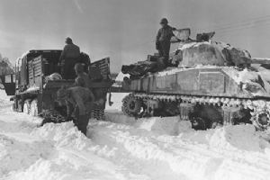 Members of 7th Armoured Division fuel their tank at Walmaz
