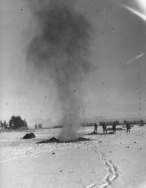 Explosive charges used to dig foxholes for protection